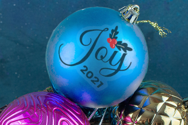 Use temporary tattoos to create completely personalized holiday ornaments